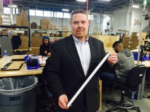 Jason Deist-Director of Operations, holds a 2 ft. LED assembly that is being furnished to the US Navy.